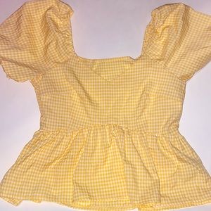 Yellow and white plaid top.